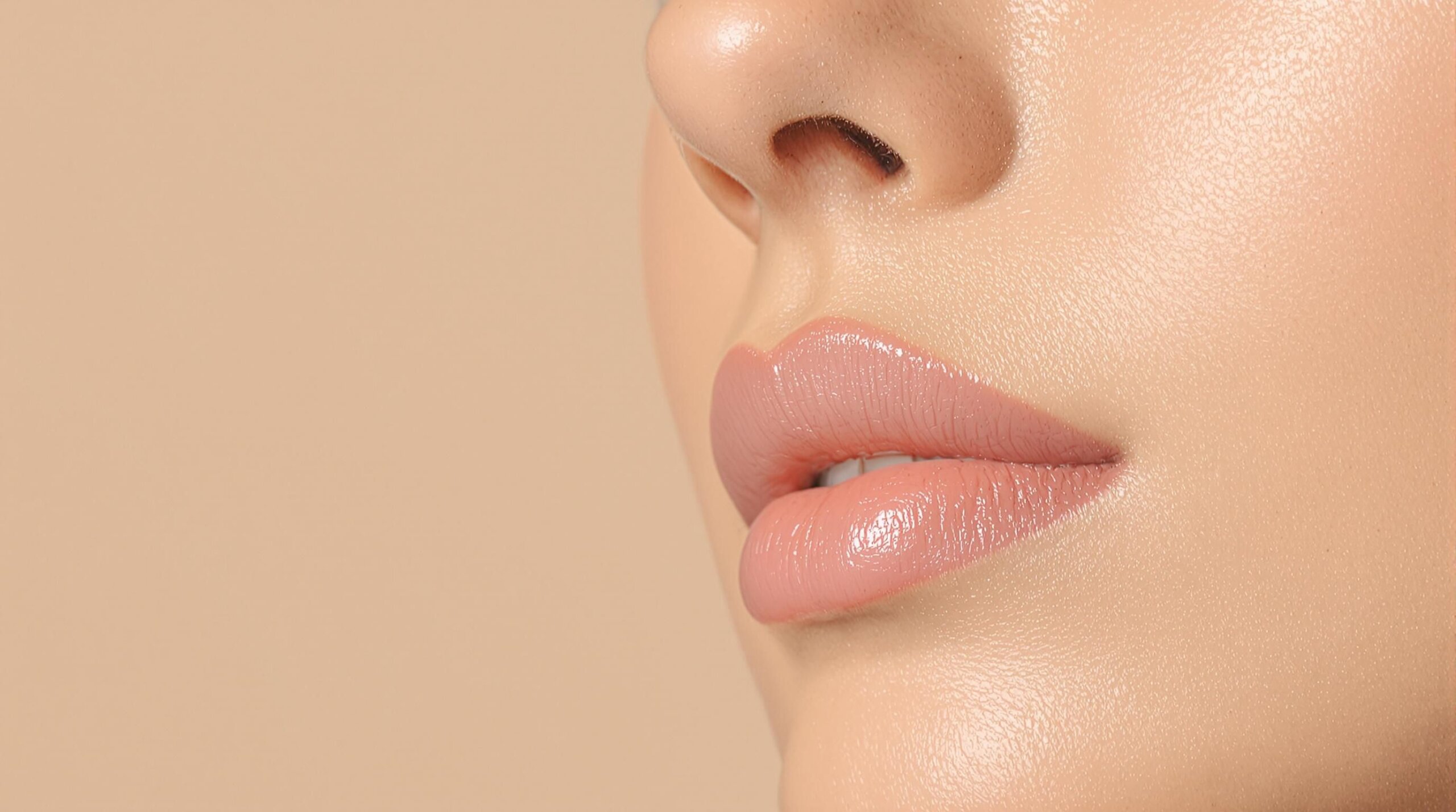 A woman's face with glowing, dewy skin.