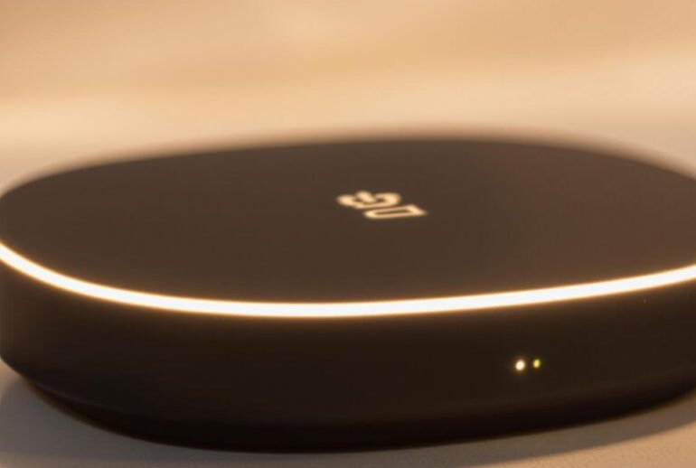 Smart home hub with glowing lights.