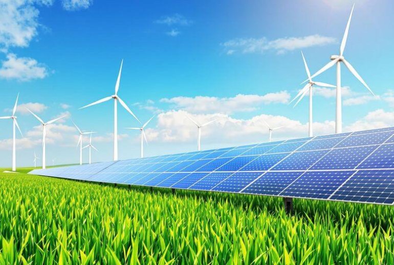Solar panels and wind turbines in a green landscape.