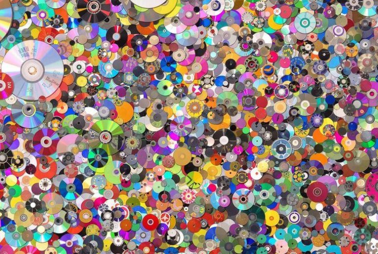 Collage of creative recycled CD crafts and decorations.